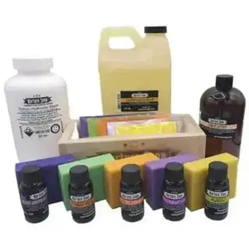 Colorful solid soap bars in wooden tray with essential oils from Soap Making Supplies