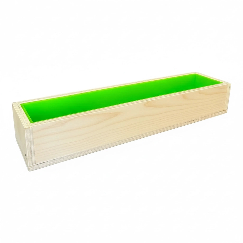 Long wooden soap mold with bright green silicone liner inside