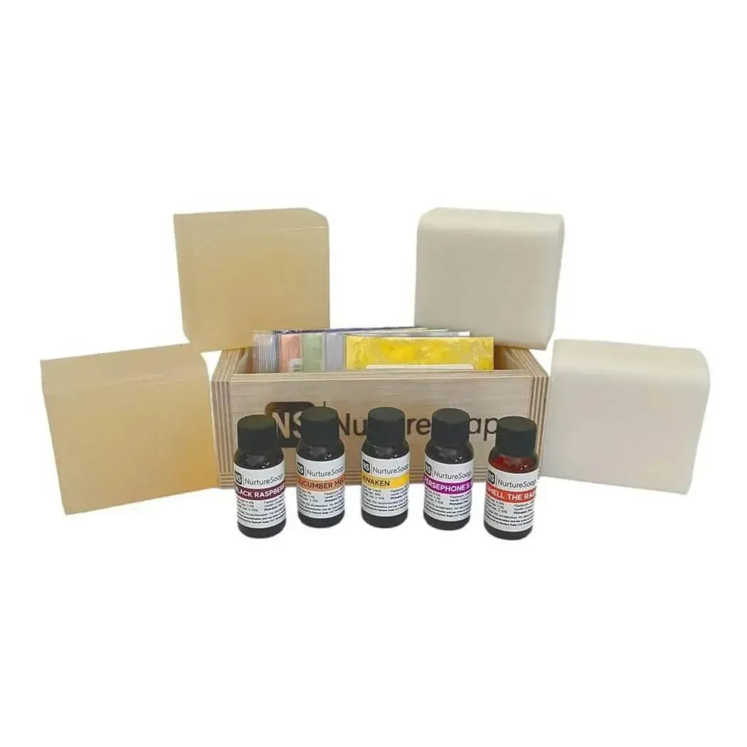 Wooden crate with five fragrance oil bottles and four cream soap blocks
