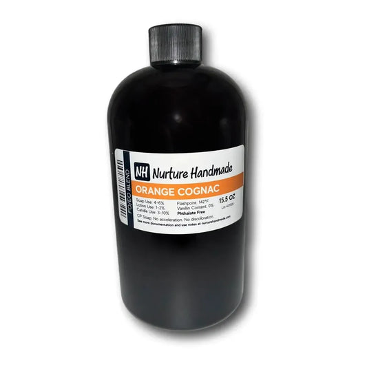 Bottle of Nurture Handmade Orange Cognac fragrance oil, 15.5 oz, featuring rich almond and citrus notes for a festive scent.