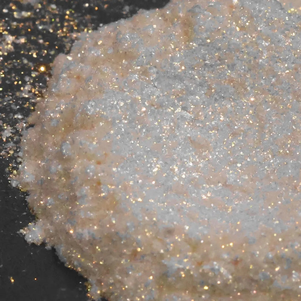 Golden Drift Mica Glitter: shimmering iridescent pile in peach and silver hues