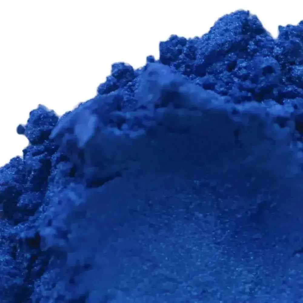 Mound of deep royal blue mica powder with shimmer