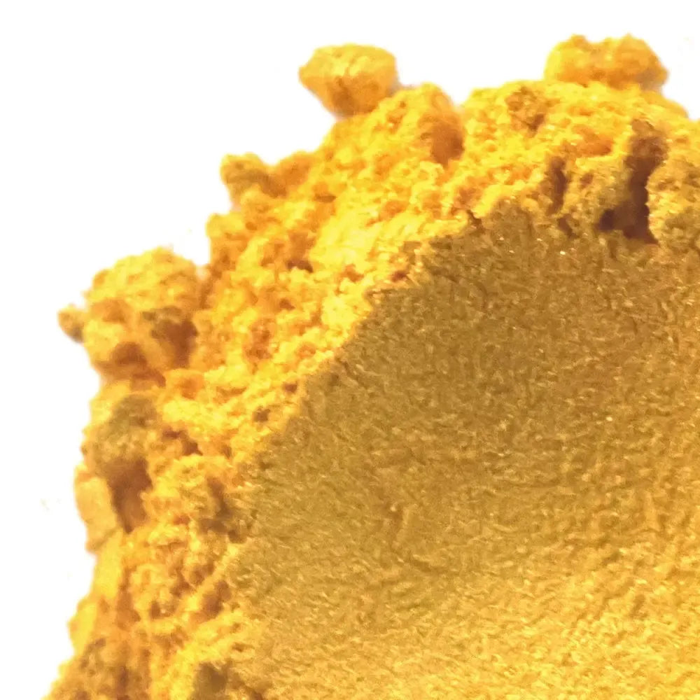 Mound of golden yellow mica powder with metallic sheen