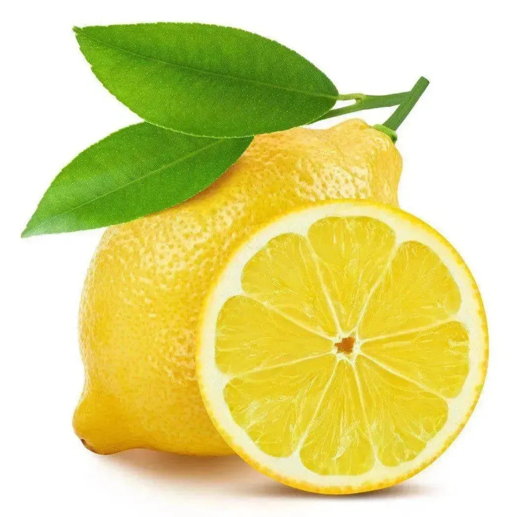 Whole lemon with two leaves beside a halved lemon