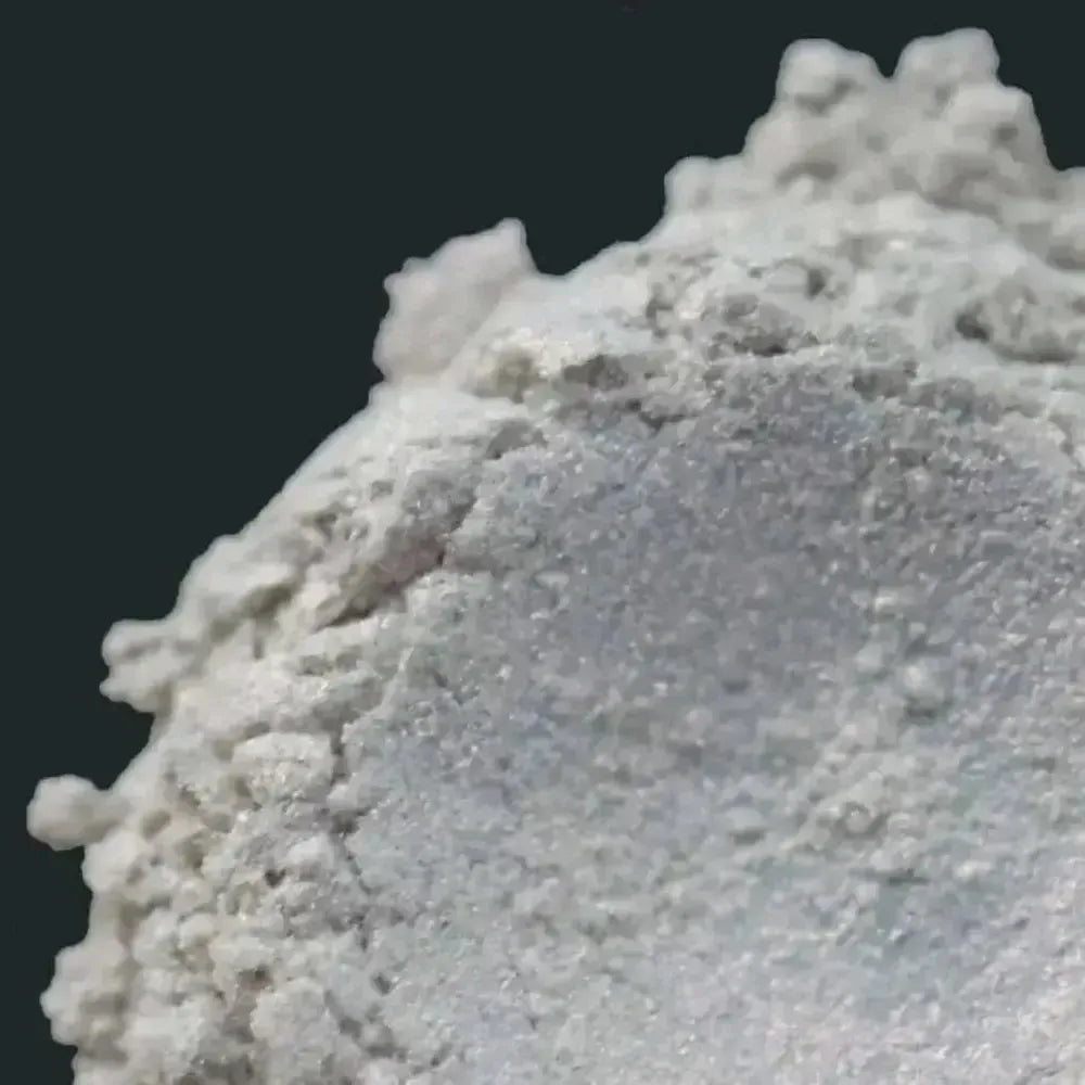 Red Enigma White Red Mica: fine white crystalline powder mound with gritty texture and shimmer
