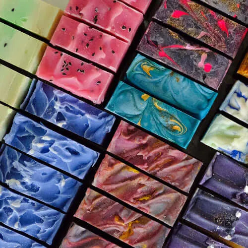 Colorful handcrafted soap bars with vibrant swirls and glitter inclusions