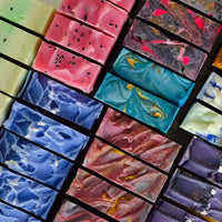 Colorful handcrafted soap bars with vibrant swirls and glitter inclusions