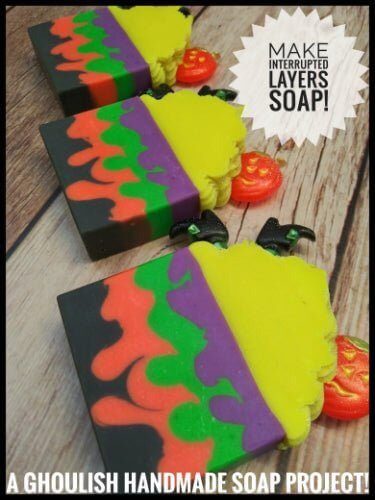 Colorful Halloween soap with interrupted layers in black, green, purple, and orange, with pumpkin and bat decorations by Nurture Handmade.