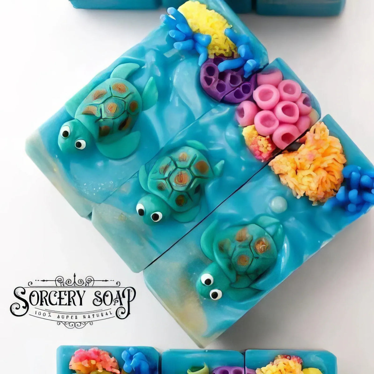 Blue turtle-themed soap bars with coral details and Sorcery Soap logo