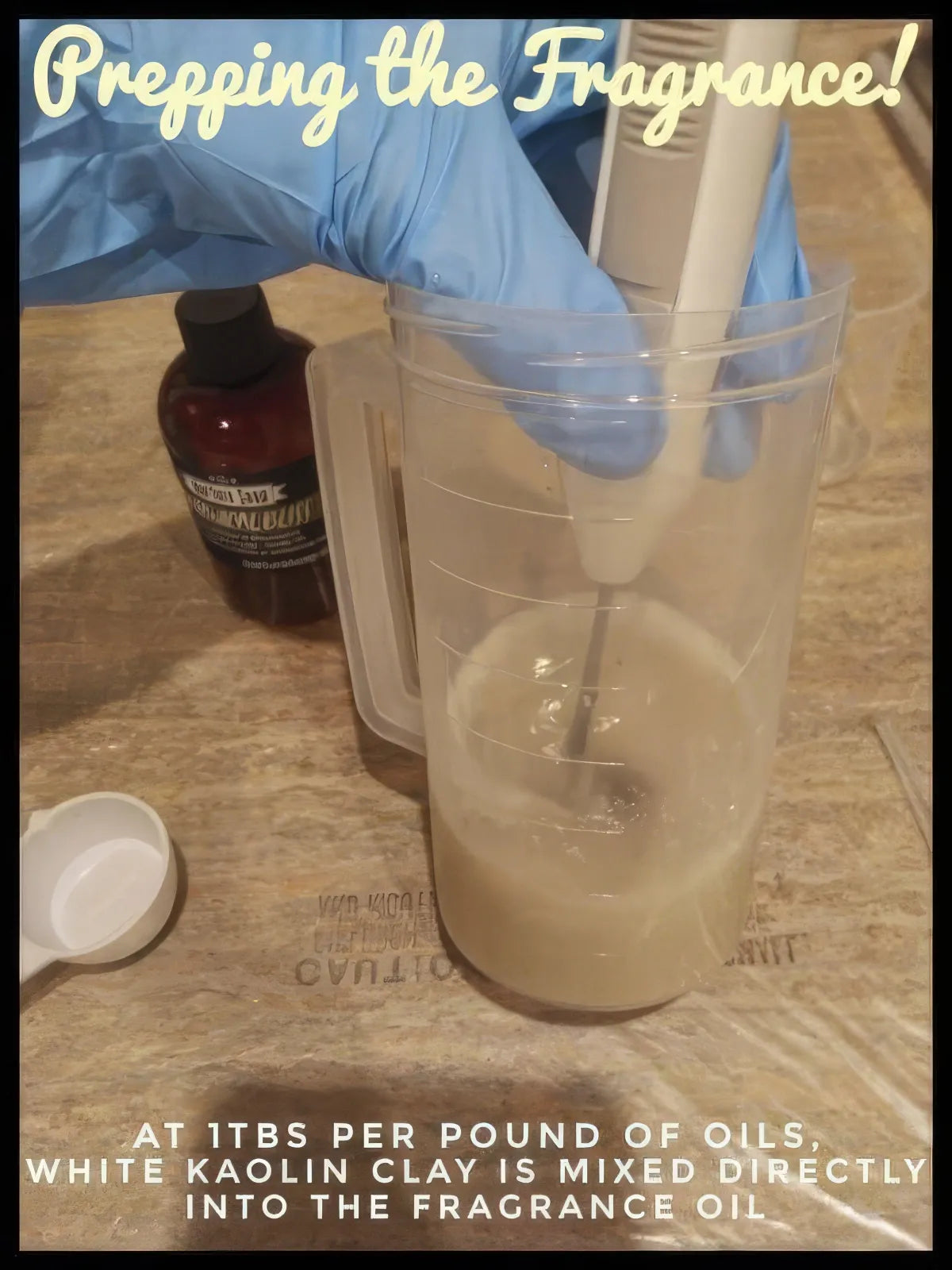 Gloved hand blending white kaolin clay into fragrance oil in pitcher