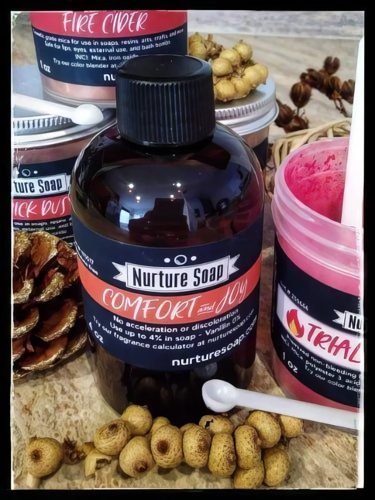 Nurture Soap Comfort and Joy fragrance bottle among labelled mica jars