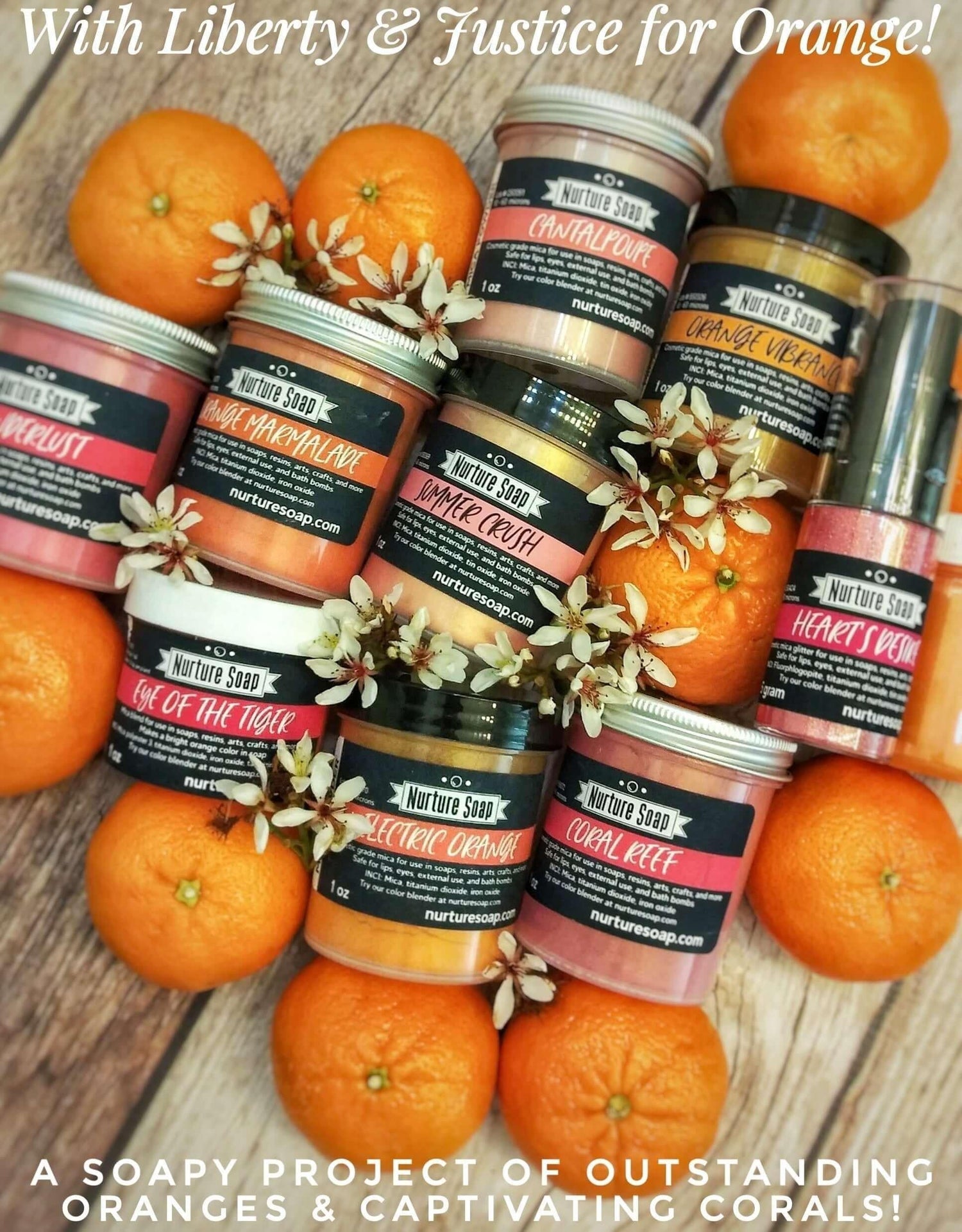 Orange and coral mica jars arranged among clementines and white blossoms