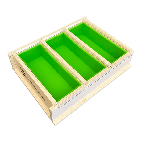 Triple compartment green soap mold with wooden frame for easy soap making.