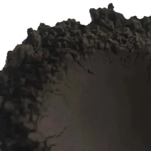 Close-up of natural clay revealing earthy texture for soap making with plant pigments.