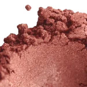 Rich, shimmery brown makeup powder perfect for adding a touch of glam to any look.