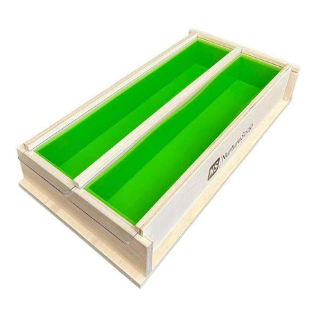 Wooden dual soap mold with green silicone liners by Nurture Handmade.