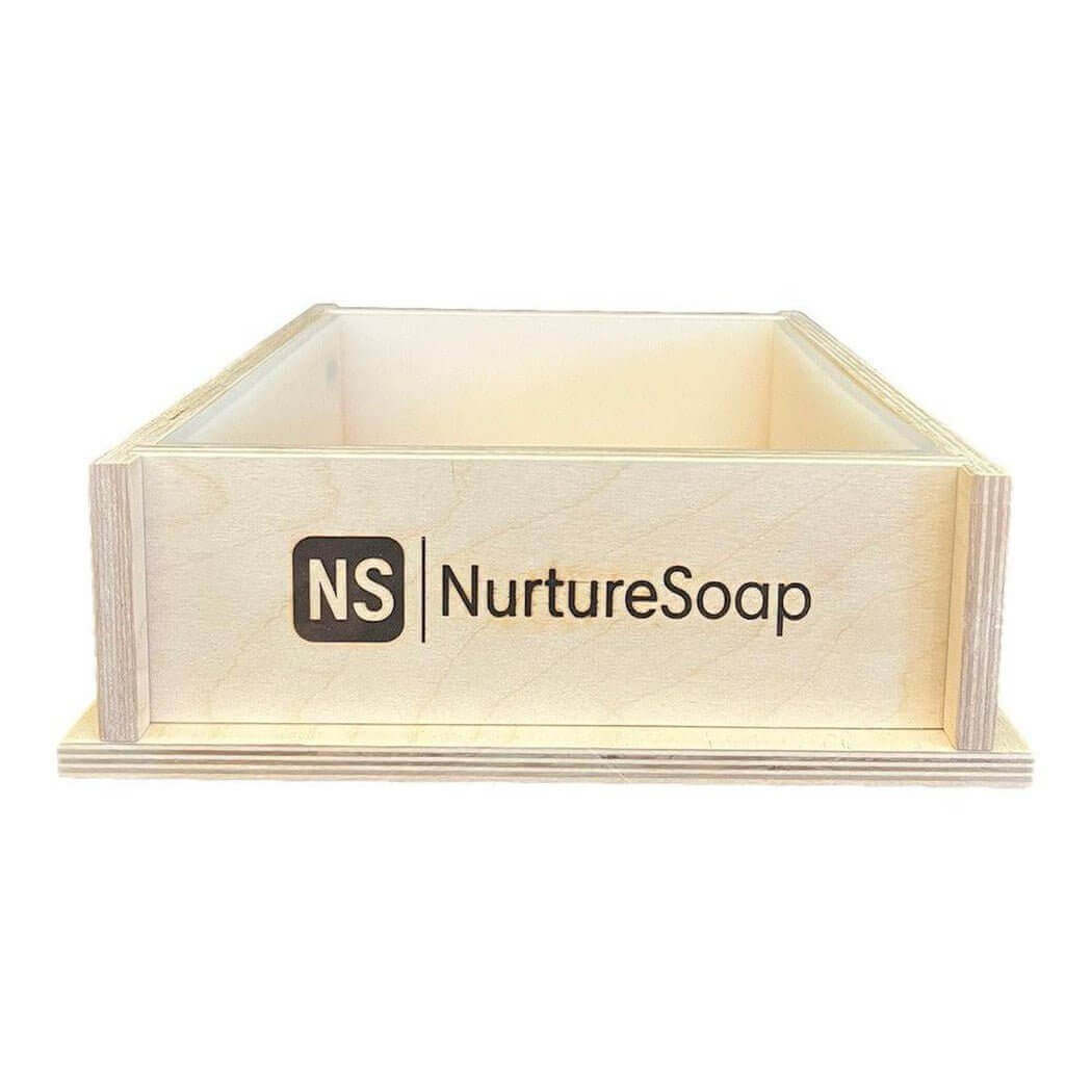 Wooden box with Nurture Soap branding for handmade soap molds.