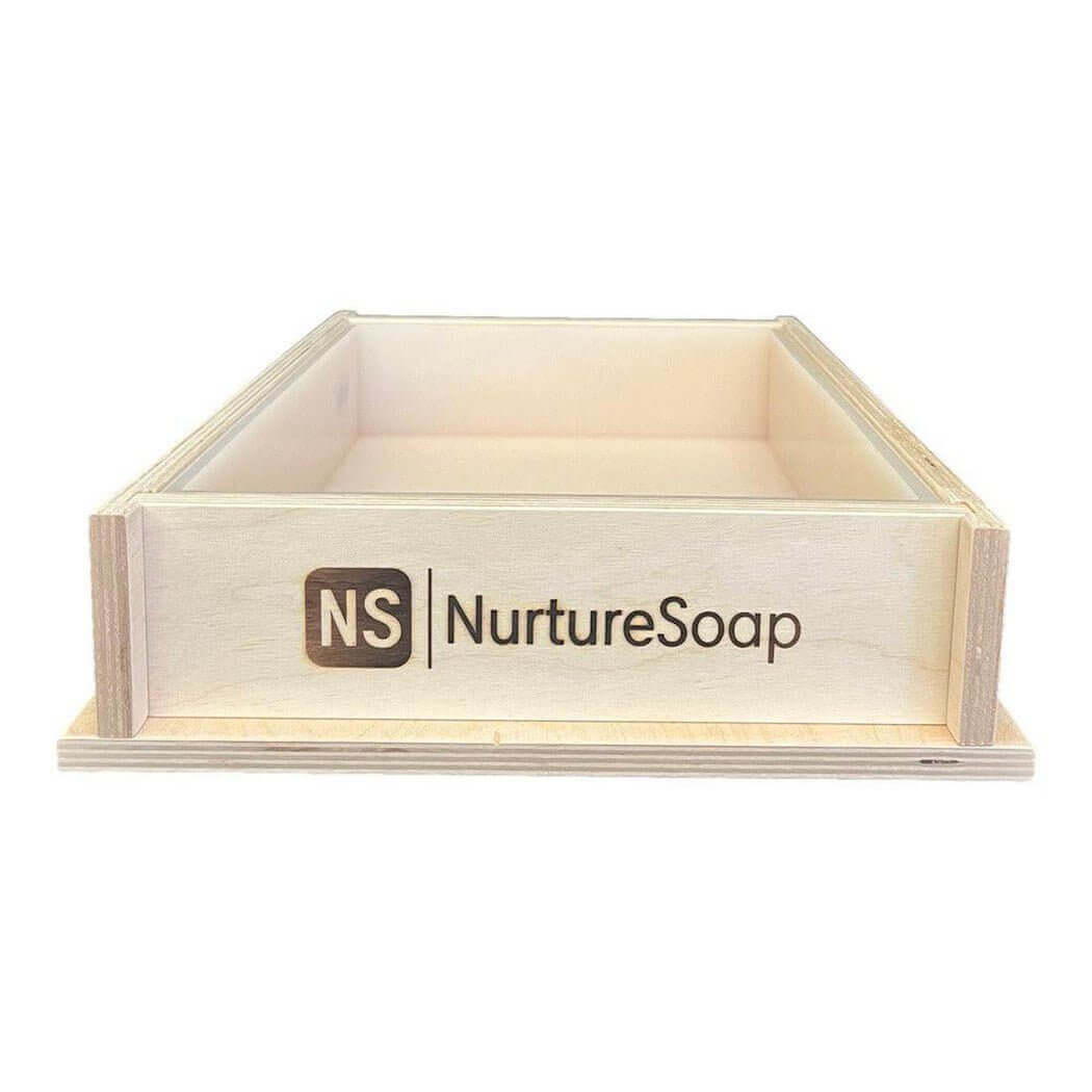 Wooden soap mold with Nurture Soap branding for handmade soap making