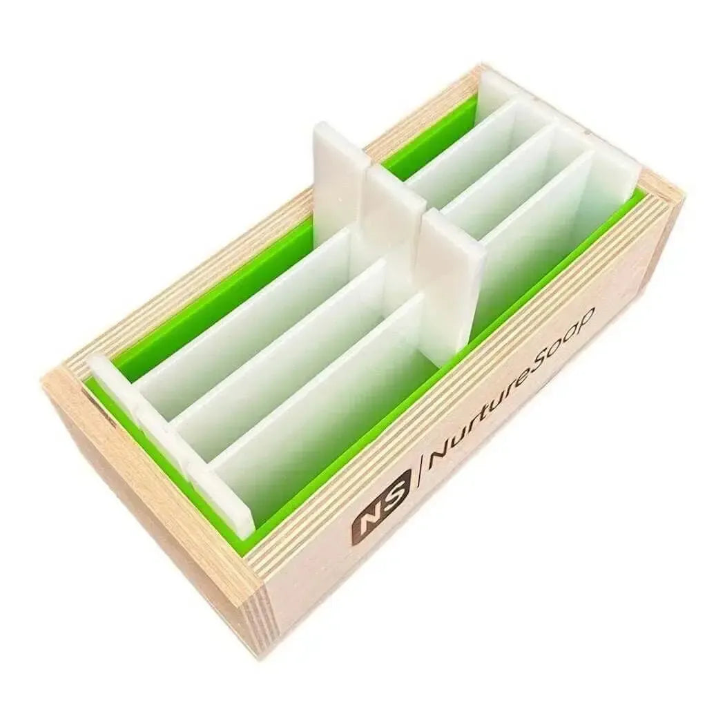Light wood soap mold with white and green swirl divider inserts, nurturesoap brand