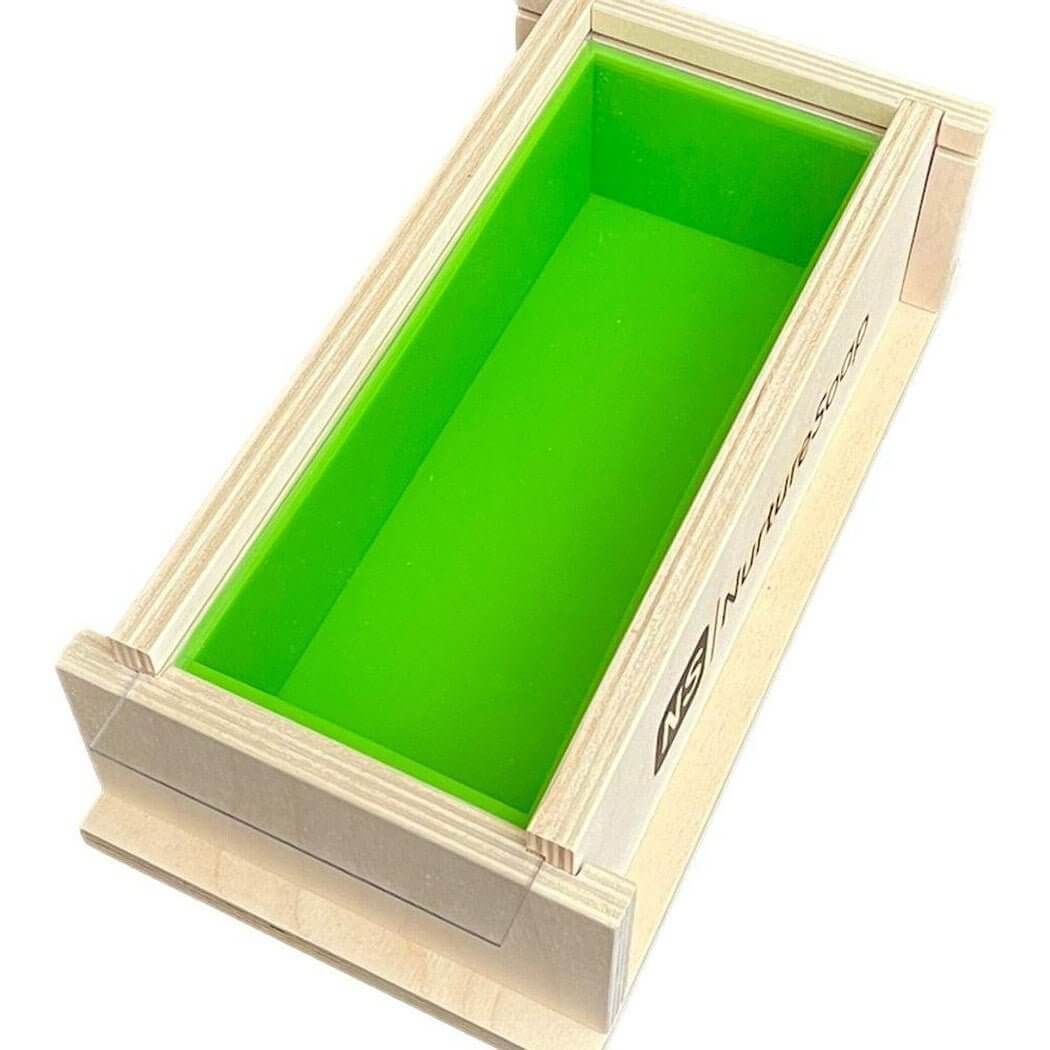 Wooden soap mold with green silicone insert by Nurture Handmade.