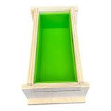 Green and wooden box mold for handmade soap or crafts, ideal for nurturing creative projects.