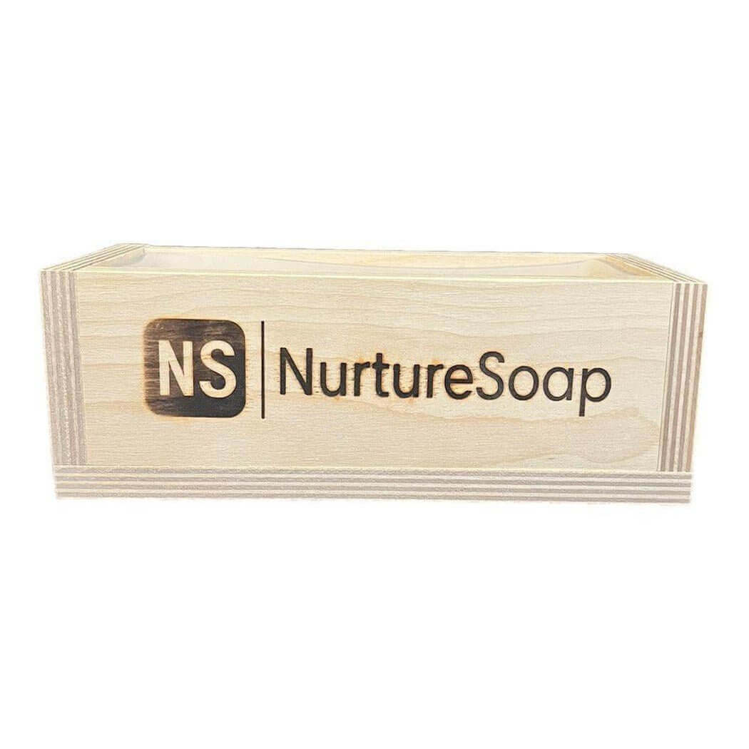 Wooden soap mold engraved with Nurture Soap logo for handmade soap making.