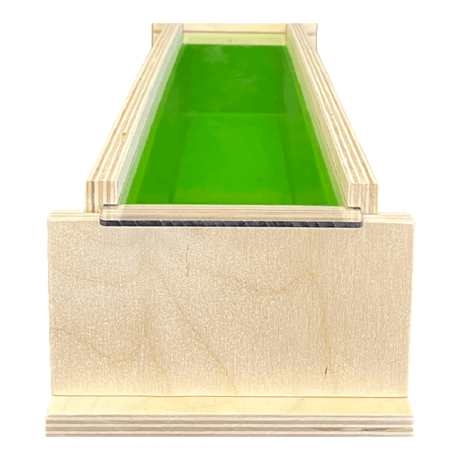 Handmade wooden mold box for soap making with green interior, ideal for nurturing and crafting homemade soaps.