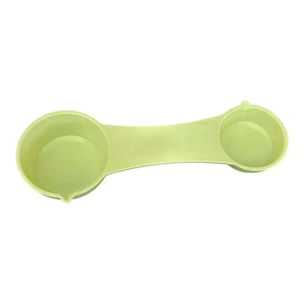 Light green silicone 4-way measuring spoon with two compartments
