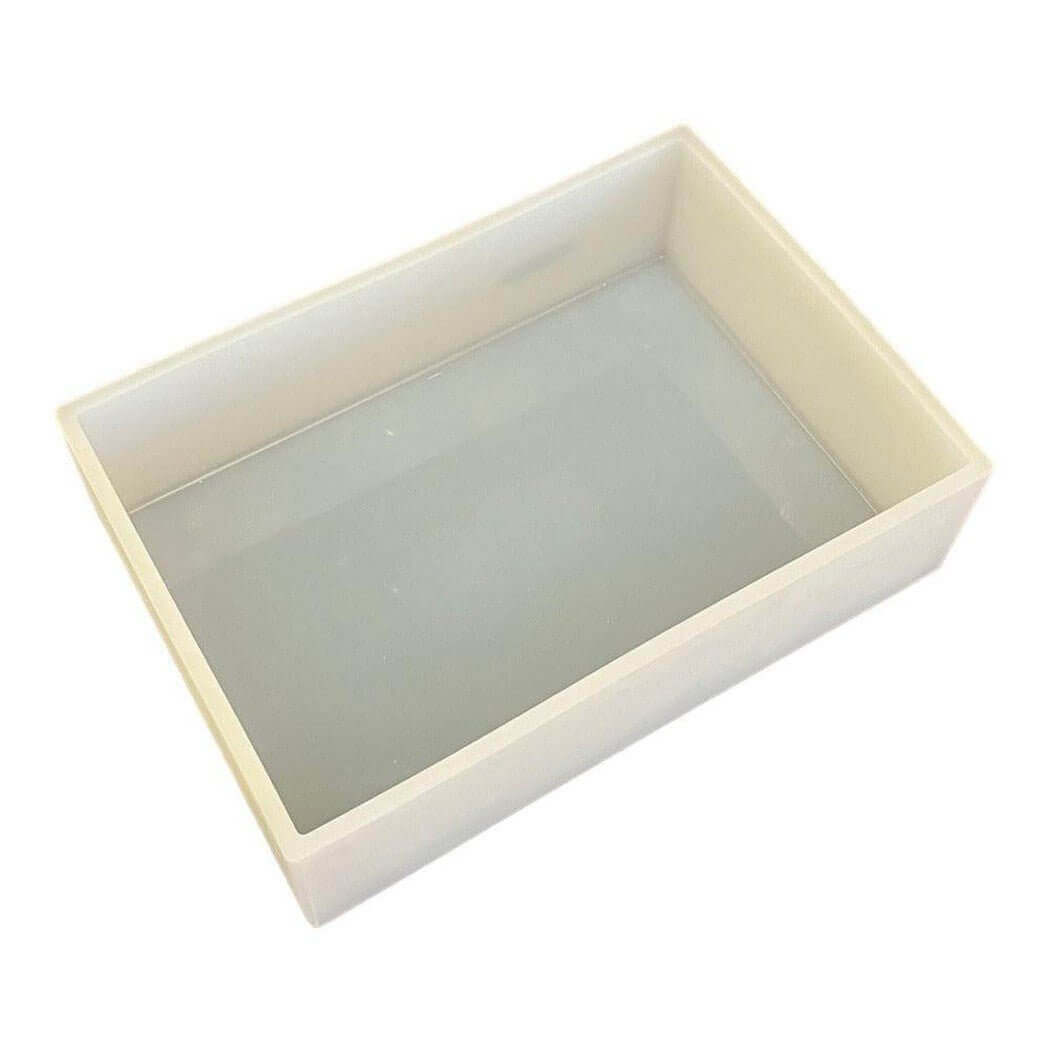 Nurture Handmade white rectangular container with clear base.