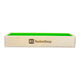 Wooden soap mold from Nurture Soap with a green interior, perfect for handmade soap crafting and nurturing creativity.