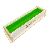 Wooden soap mold with green interior and Nurture Soap branding for handmade soap crafting.