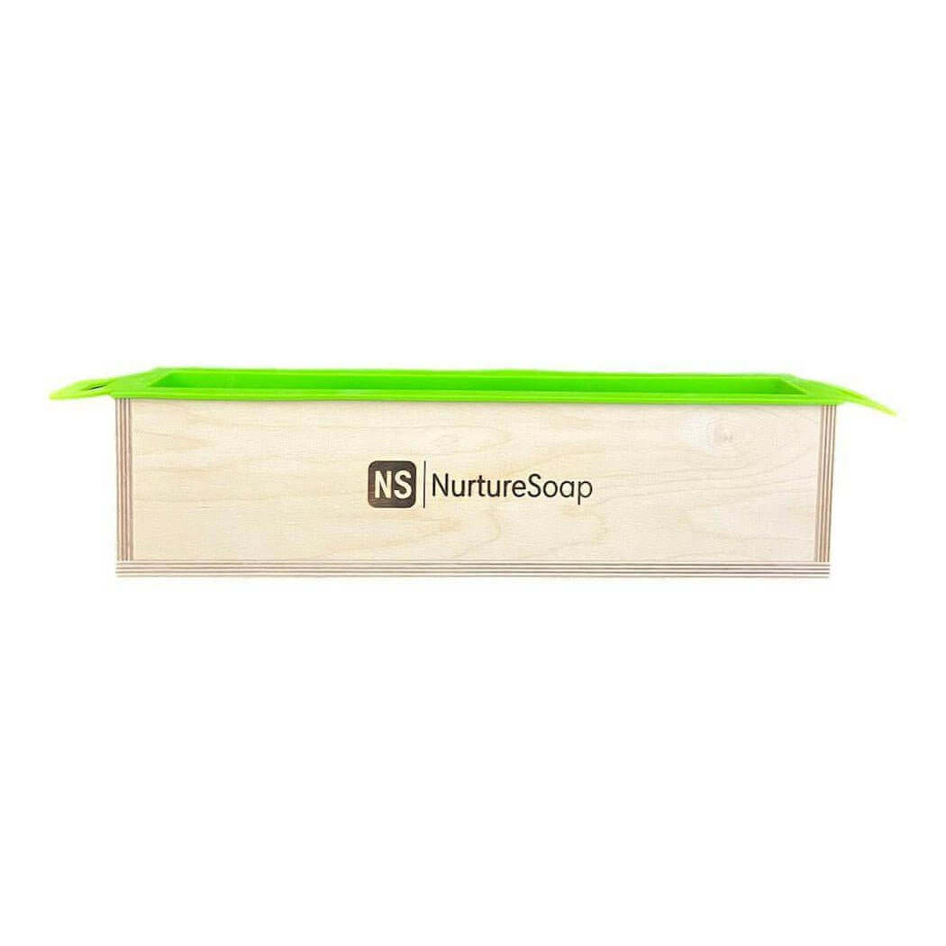 Nurture Handmade wooden soap mold with green silicone liner from NurtureSoap. Ideal for DIY soap making and crafts.