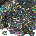 Black holographic flower sequins with rainbow iridescent reflections in Flower Power Glitter
