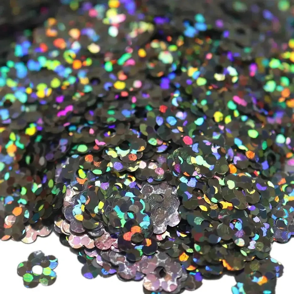 Black holographic flower sequins with rainbow iridescent reflections in Flower Power Glitter
