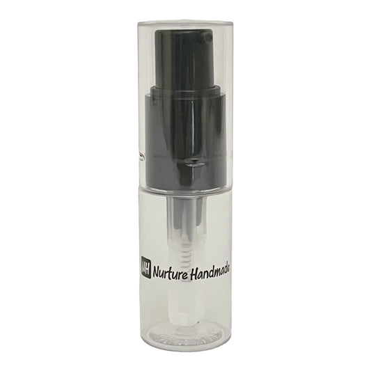Clear spray bottle with black nozzle on a white background, featuring 'Nurture Handmade' branding.
