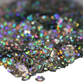 Holographic black circular sequins with rainbow reflections in Lip Service glitter
