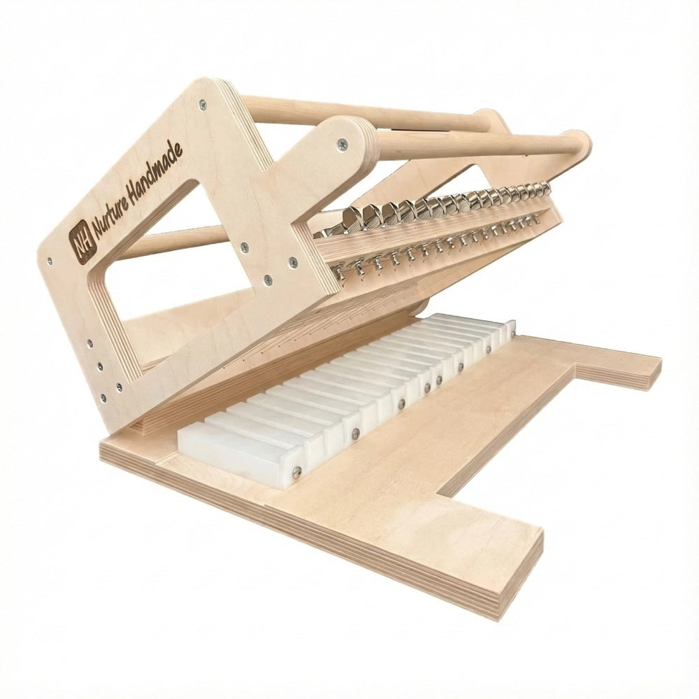 Wooden soap cutter with metal strings and tuners on a white background