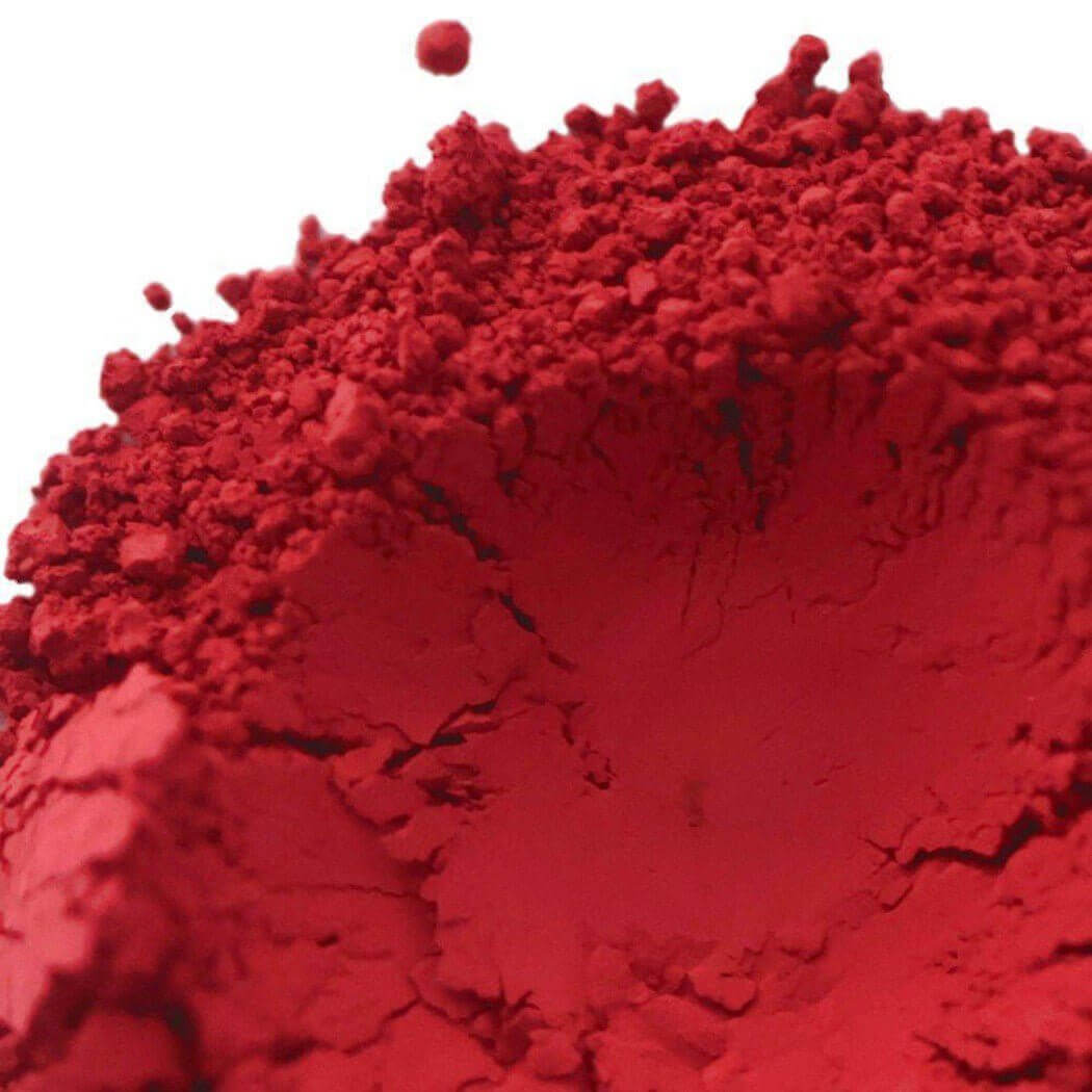 Close-up of vibrant red handmade pigment powder from Nurture Handmade.