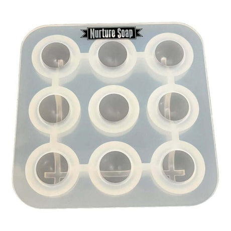 Nurture Handmade soap mold with 9 round cavities for crafting soap.