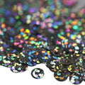 Black holographic smiley face sequins with iridescent rainbow reflections