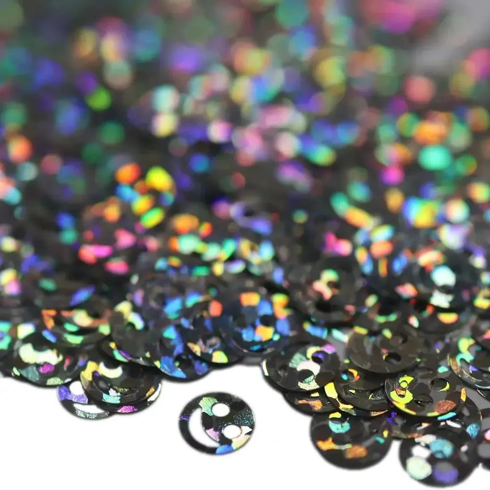 Black holographic smiley face sequins with iridescent rainbow reflections