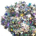 Pile of iridescent star confetti with holographic metallic finish from Stardust Glitter