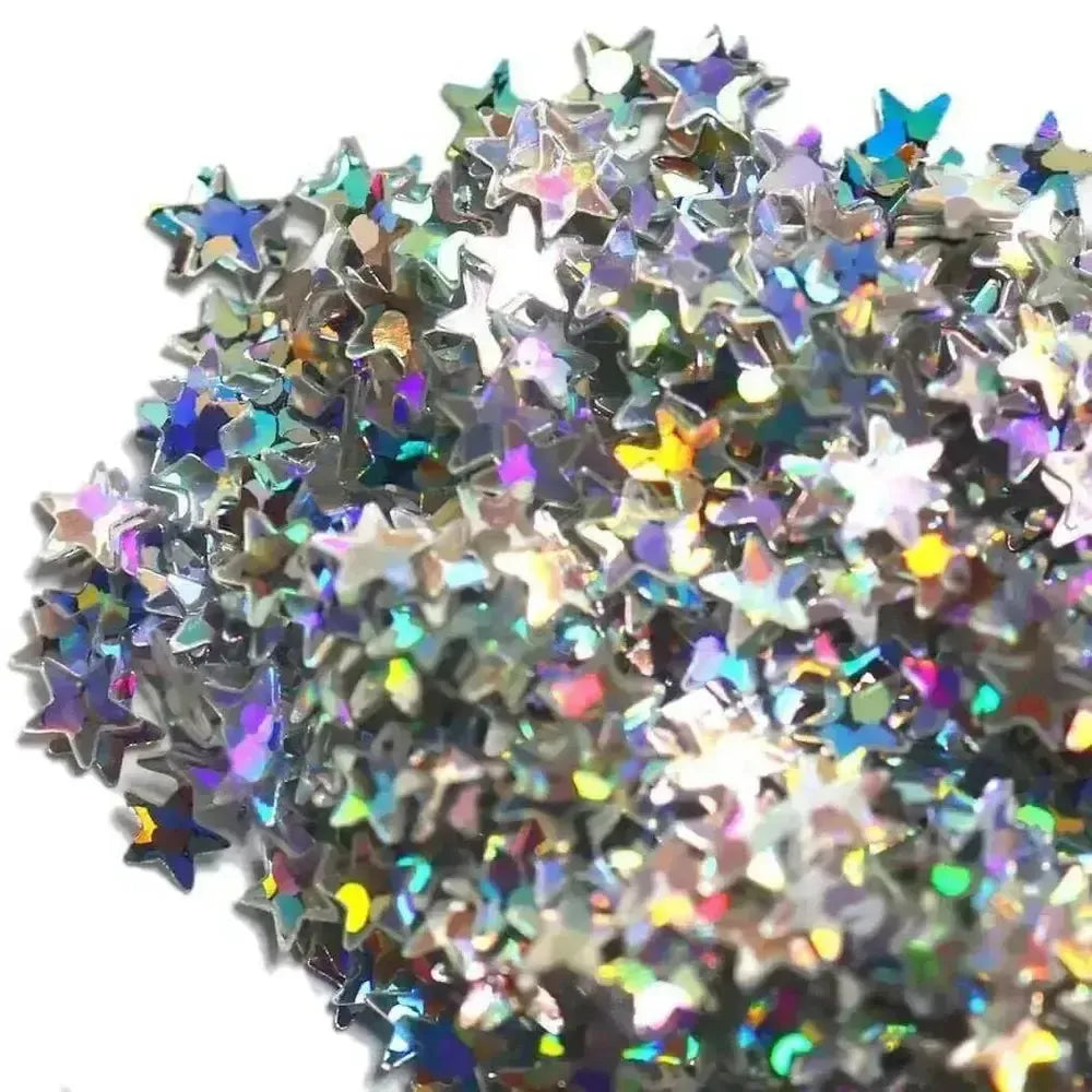 Pile of iridescent star confetti with holographic metallic finish from Stardust Glitter