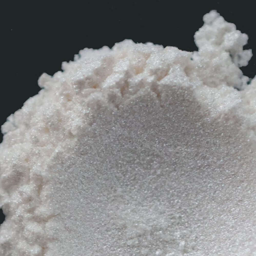 Close-up of fine white powder, perfect for nurture handmade crafting and natural skincare products.