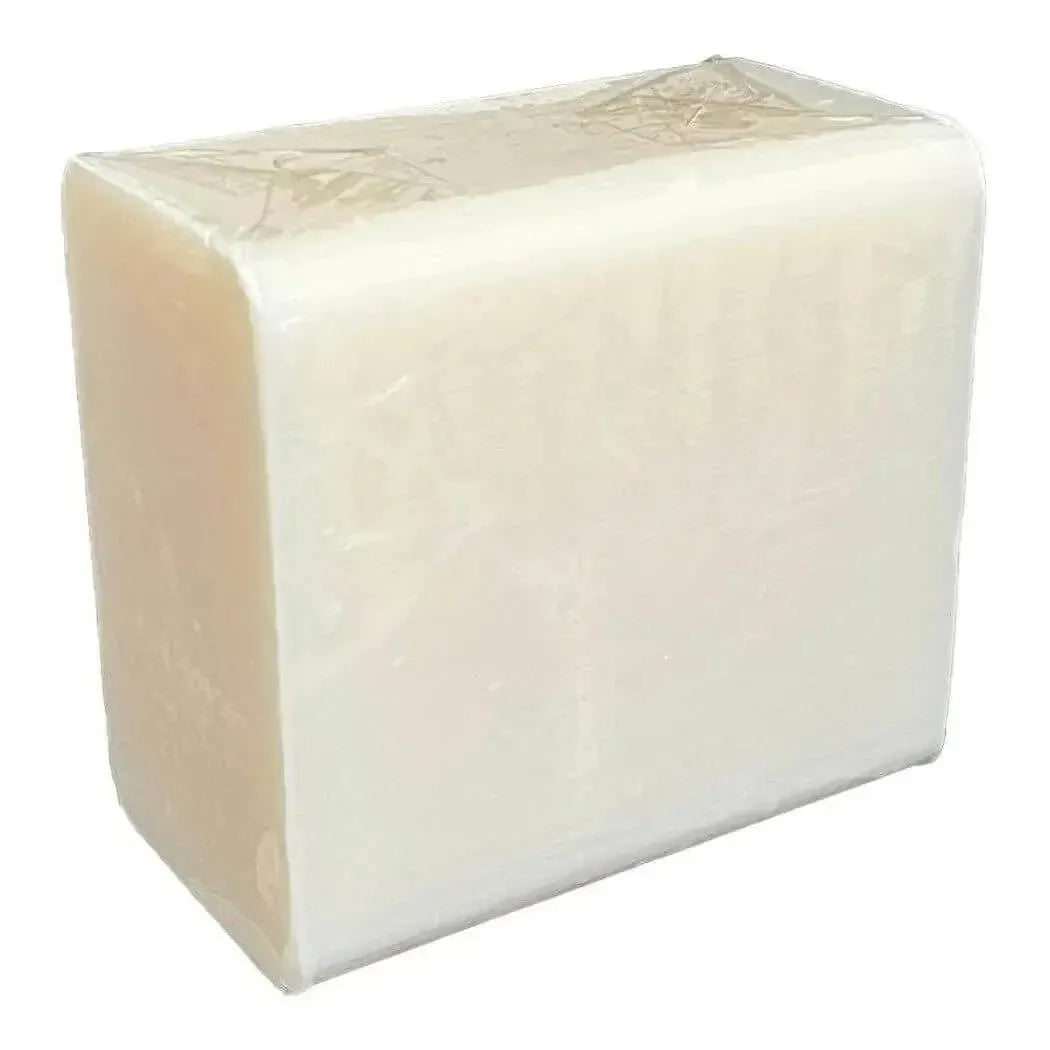 Rectangular opaque white soap base block with plastic wrap on top