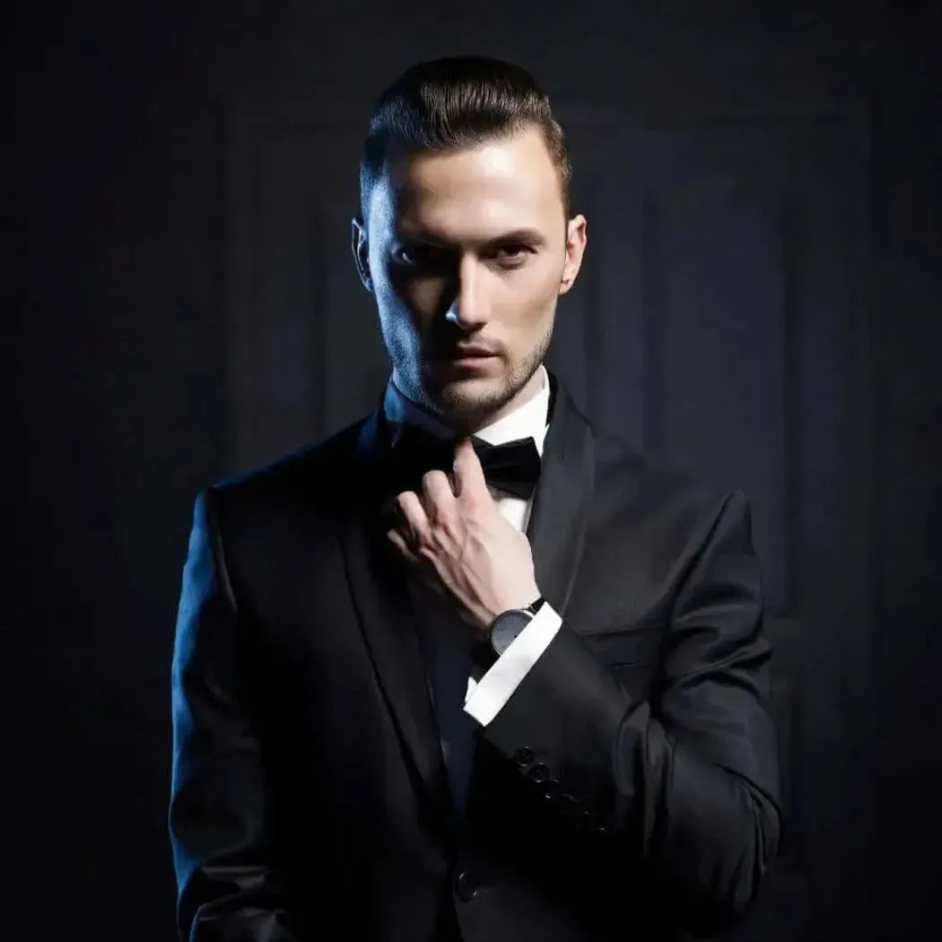 Black tuxedo jacket with satin lapels and matching bow tie for Aristocrat Fragrance Blend