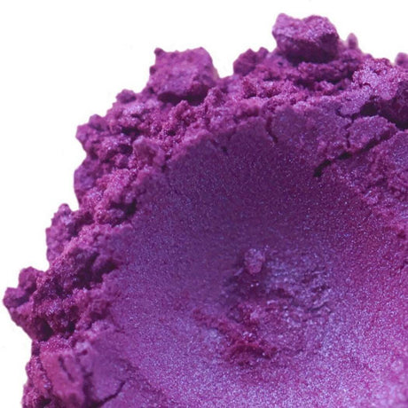 Close-up of vibrant purple handmade pigment in powdered form by Nurture Handmade.