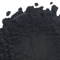 Pile of dark irregular black iron oxide coal chunks