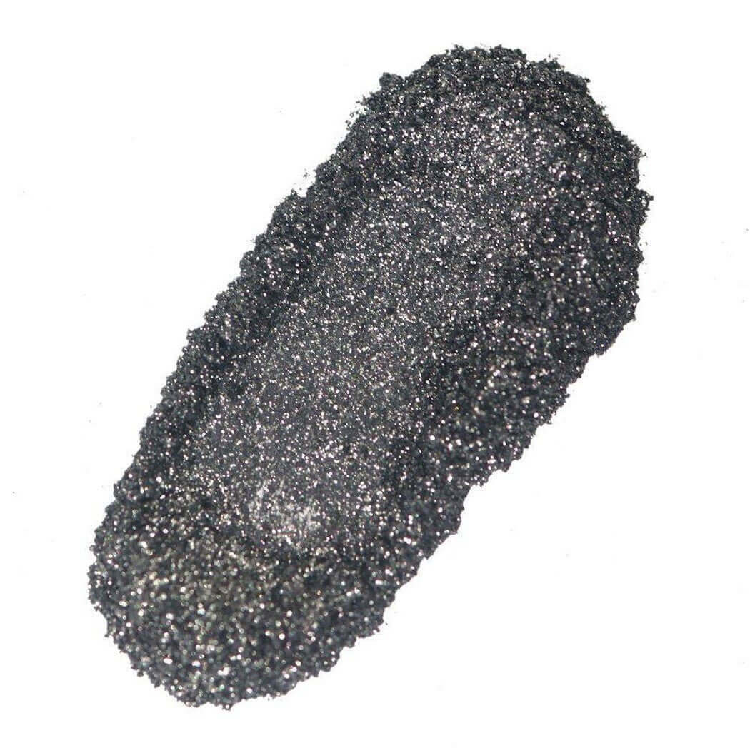 Sparkly black eyeshadow swatch demonstrating Nurture Handmade's glittery cosmetic product.