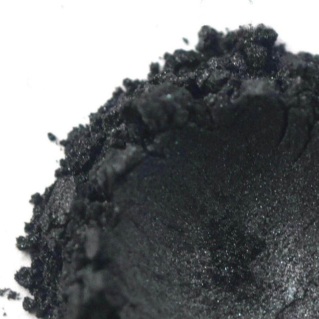 Close-up of black powdered pigment used in Nurture Handmade products